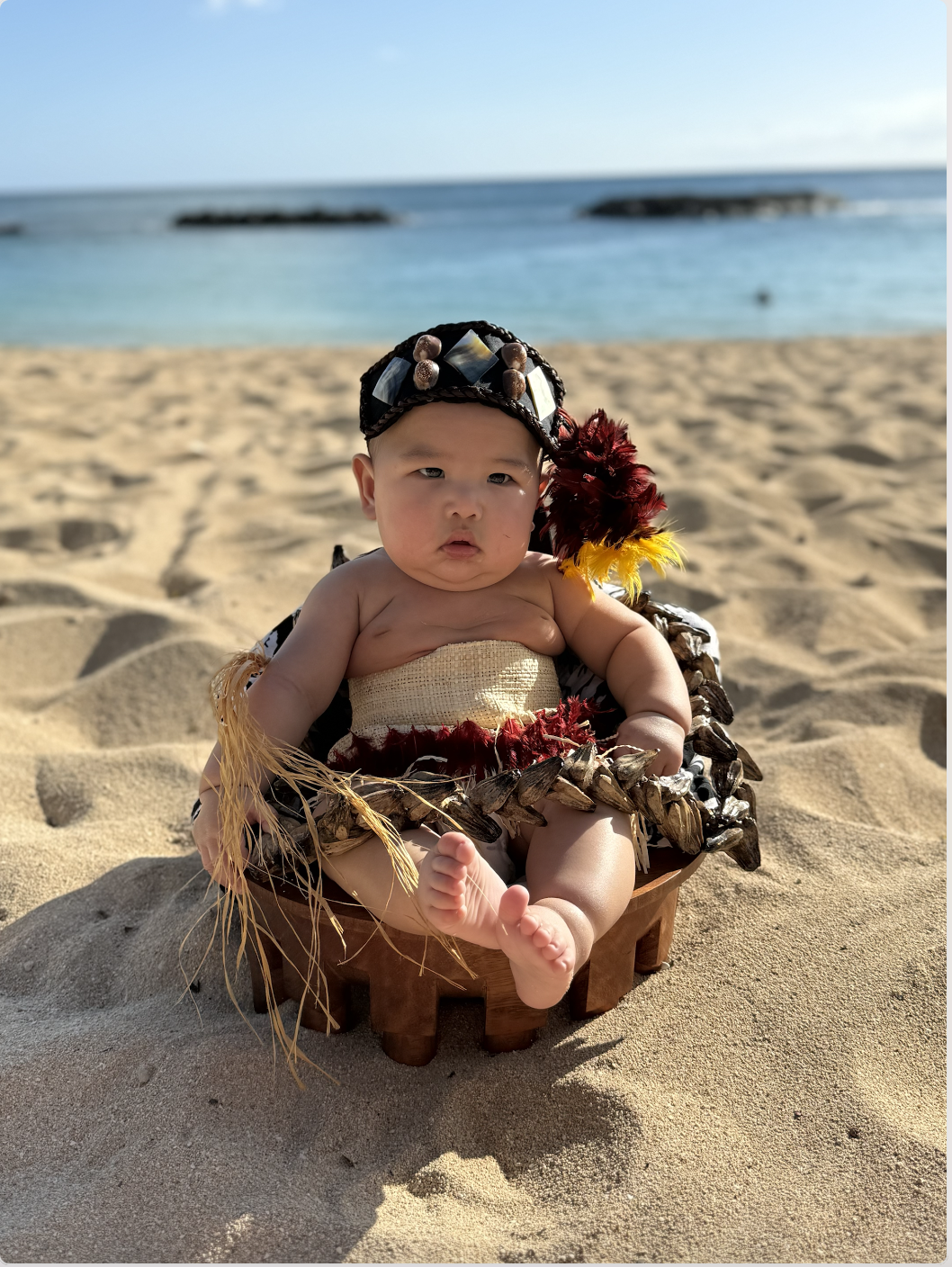 Grandbaby in traditional Hawaiian attire on the beach